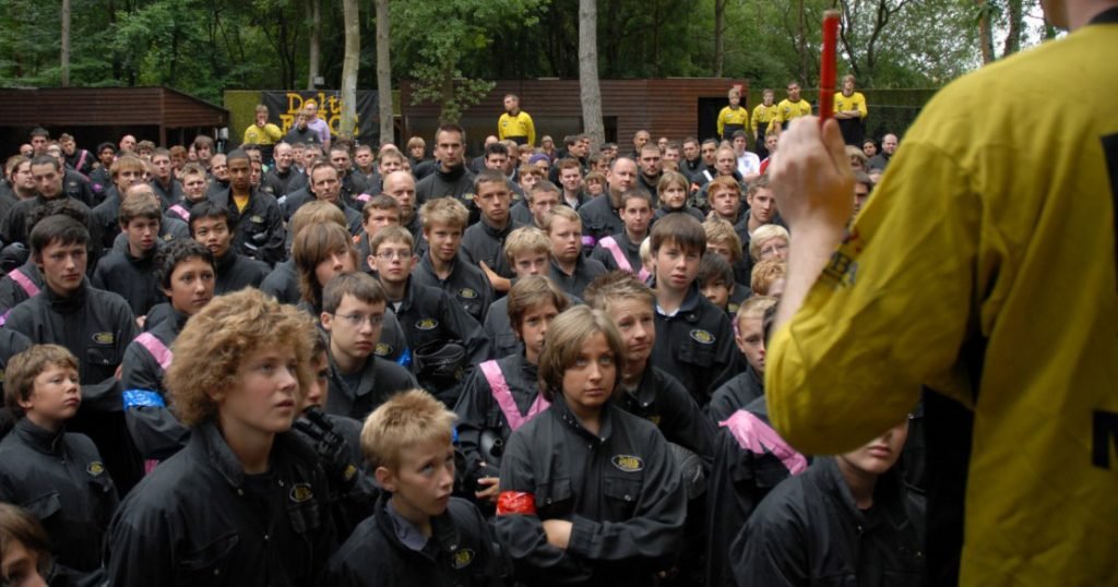 Children receiving their Safety Briefing before a day of Paintball action Children paying attention to a Paintball safety brief